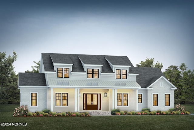 view of front of home featuring a porch and a front yard