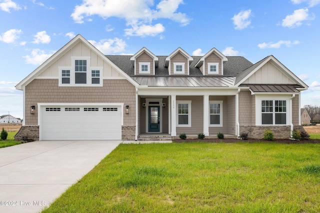 craftsman-style home featuring a front yard and a garage