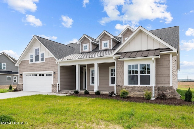 craftsman-style house with a front lawn, a porch, and a garage