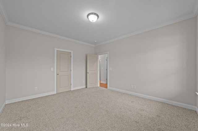 unfurnished bedroom featuring carpet and ornamental molding