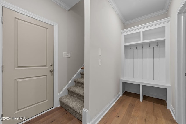 mudroom with crown molding and hardwood / wood-style floors