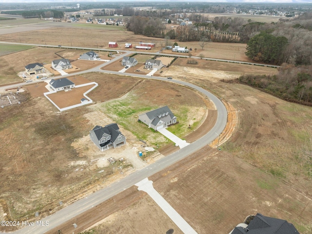 birds eye view of property with a rural view