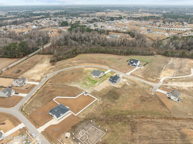 birds eye view of property with a rural view