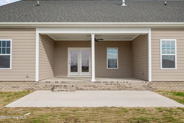 entrance to property with ceiling fan and a patio