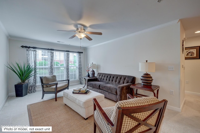 living room featuring ceiling fan, light colored carpet, and ornamental molding