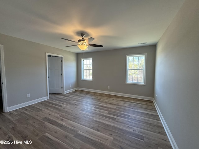 unfurnished bedroom featuring ceiling fan and wood-type flooring