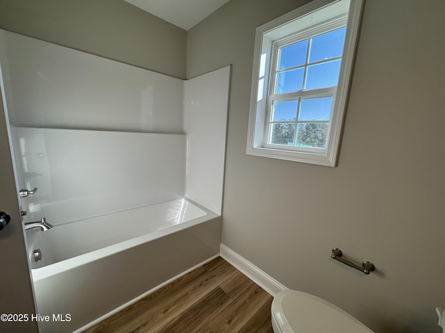 bathroom featuring toilet and hardwood / wood-style floors