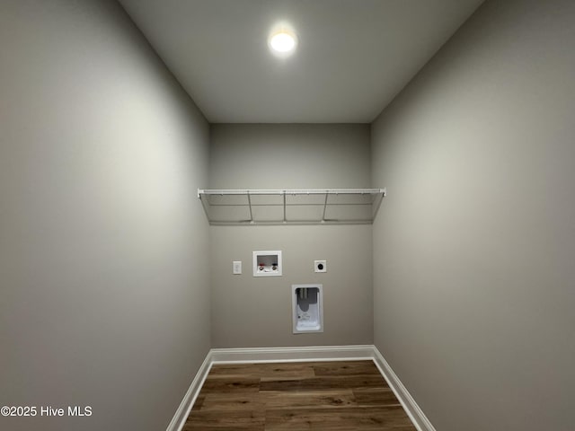 laundry room with electric dryer hookup, washer hookup, and dark hardwood / wood-style floors