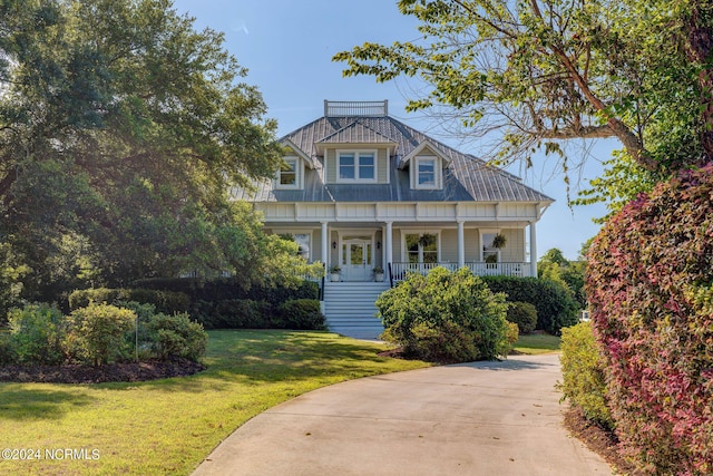 view of front facade with a porch and a front yard