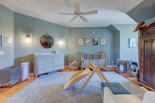 bedroom with ceiling fan and light wood-type flooring