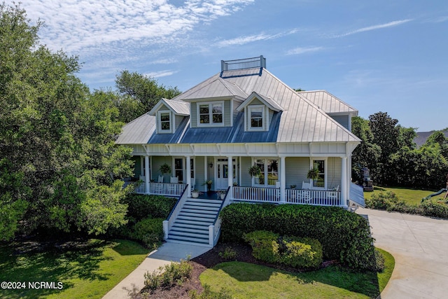 view of front of home featuring a porch and a front lawn