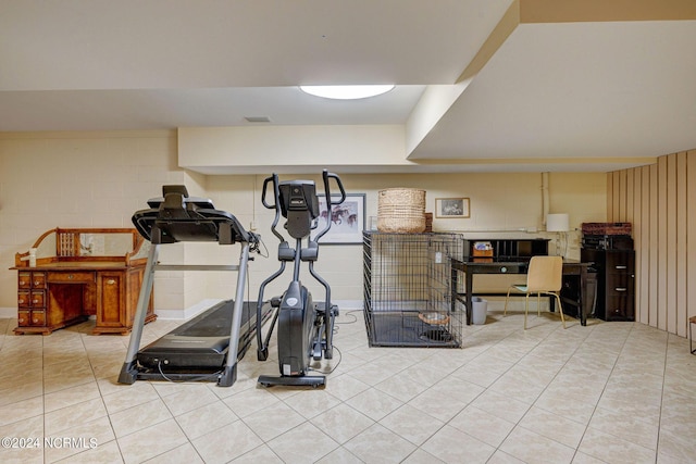 workout area with tile patterned flooring