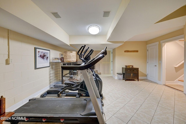 exercise area with light tile patterned flooring