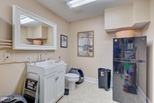 bathroom with tile patterned floors, vanity, and toilet