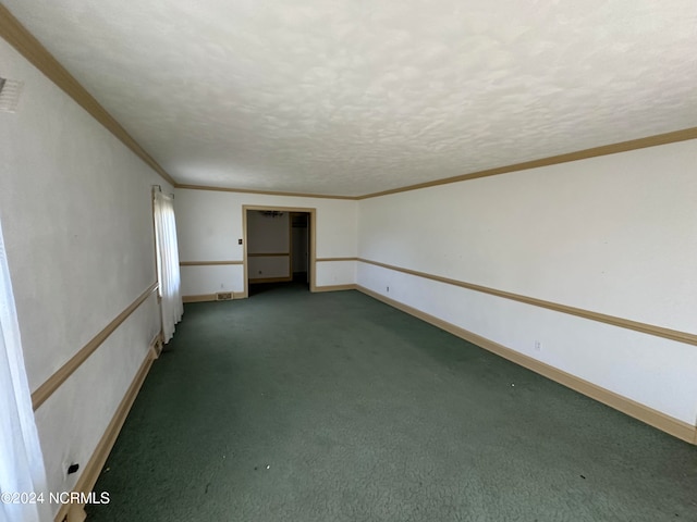 carpeted spare room featuring a textured ceiling and crown molding