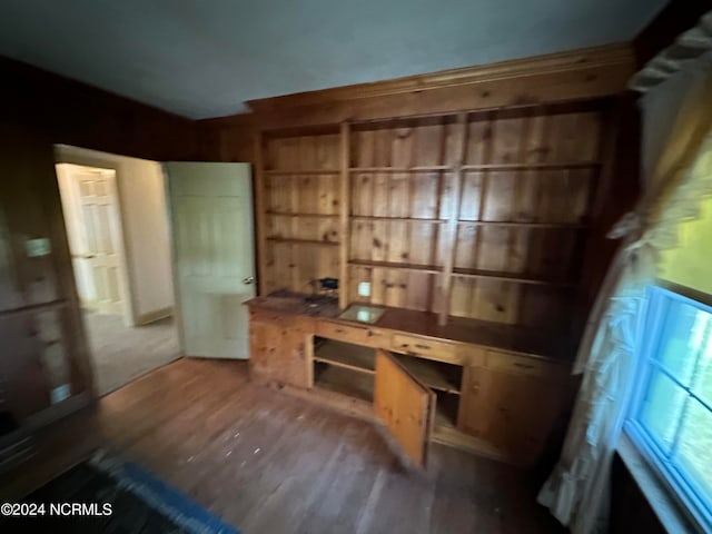 unfurnished office featuring hardwood / wood-style floors