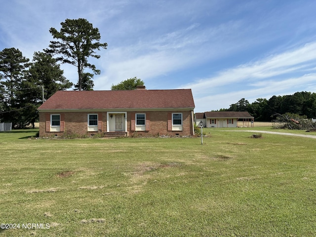 ranch-style home with a front yard