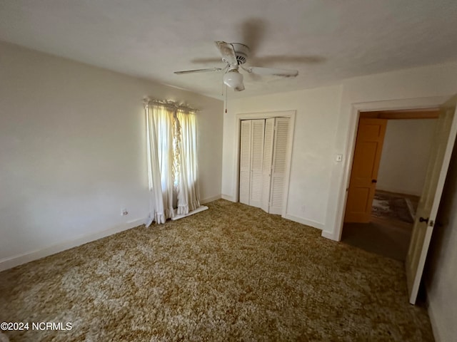 unfurnished bedroom featuring carpet, ceiling fan, and a closet