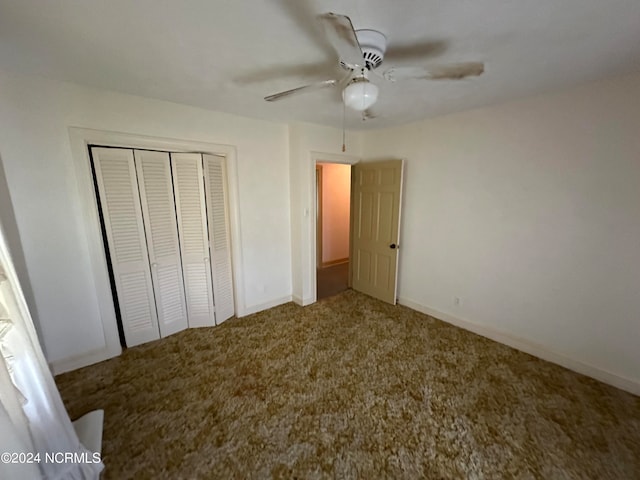 unfurnished bedroom with carpet floors, a closet, and ceiling fan