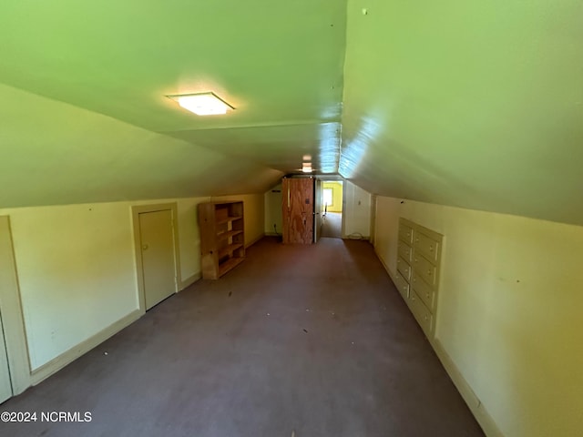 bonus room featuring carpet and lofted ceiling