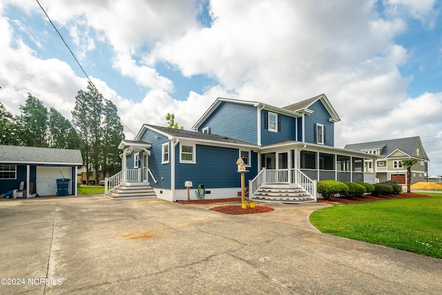 view of front of house featuring a front yard and a garage