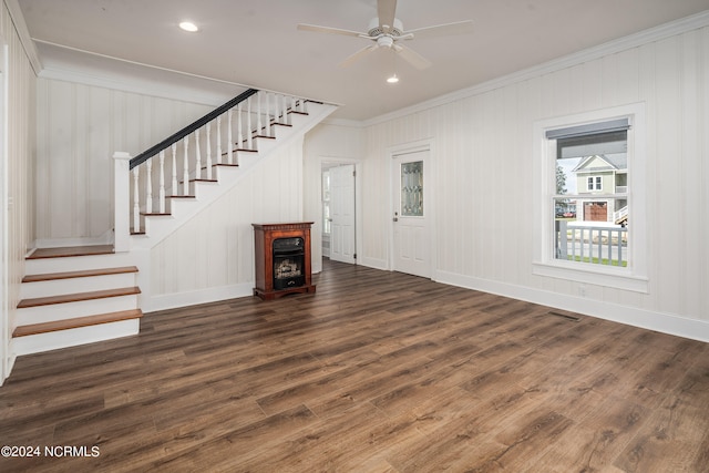 unfurnished living room with ornamental molding, ceiling fan, and dark hardwood / wood-style flooring