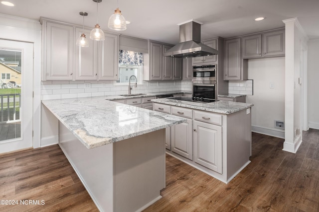 519 E Water St, Belhaven, NC 27810 - kitchen featuring wall chimney exhaust hood, stainless steel double oven, backsplash, light stone countertops, and recessed lighting