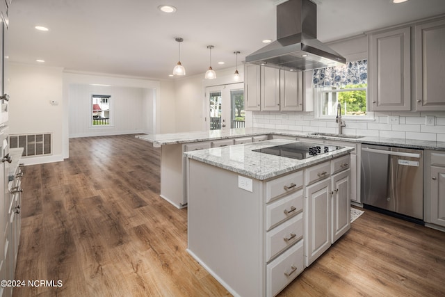 kitchen featuring island exhaust hood, black electric stovetop, a kitchen island, sink, and stainless steel dishwasher