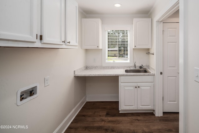 clothes washing area with hookup for a washing machine, ornamental molding, sink, cabinets, and dark hardwood / wood-style flooring