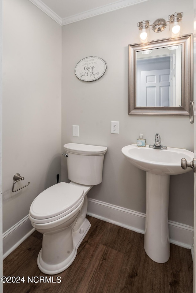 519 E Water St, Belhaven, NC 27810 - half bath featuring wood finished floors and ornamental molding