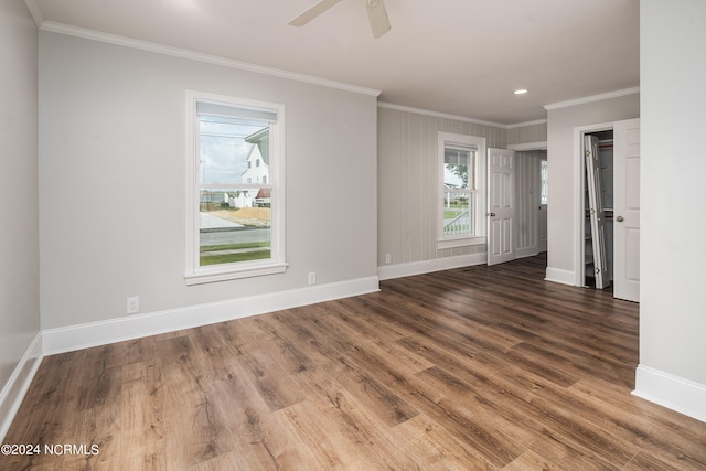 empty room with crown molding, hardwood / wood-style flooring, and ceiling fan