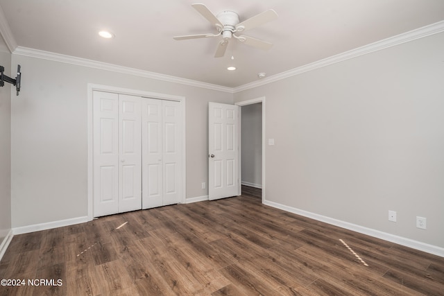 unfurnished bedroom with ornamental molding, dark hardwood / wood-style floors, and ceiling fan