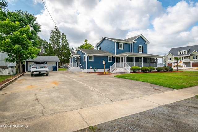 view of front facade featuring a front yard and a garage