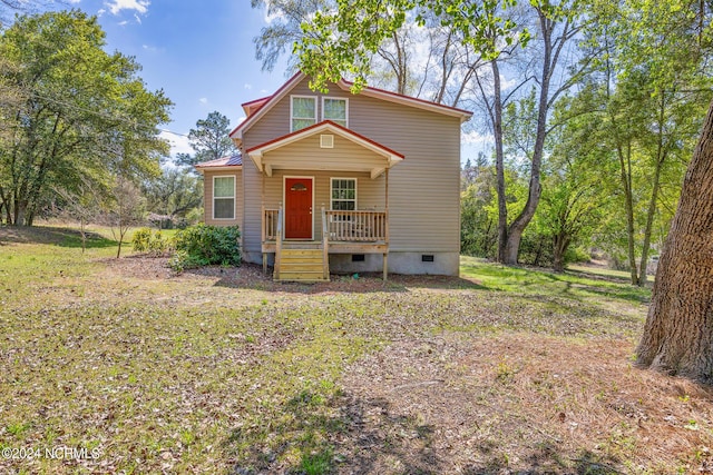 view of front of home with crawl space, metal roof, and a porch