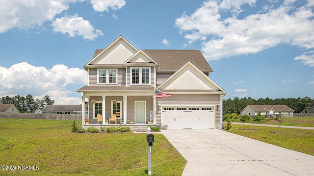 craftsman-style house featuring a garage, a front yard, and covered porch