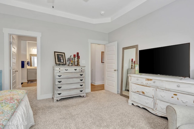 carpeted bedroom with ensuite bath