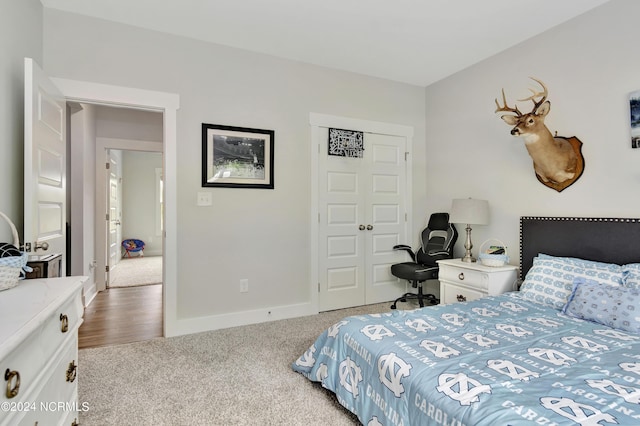 carpeted bedroom with a closet