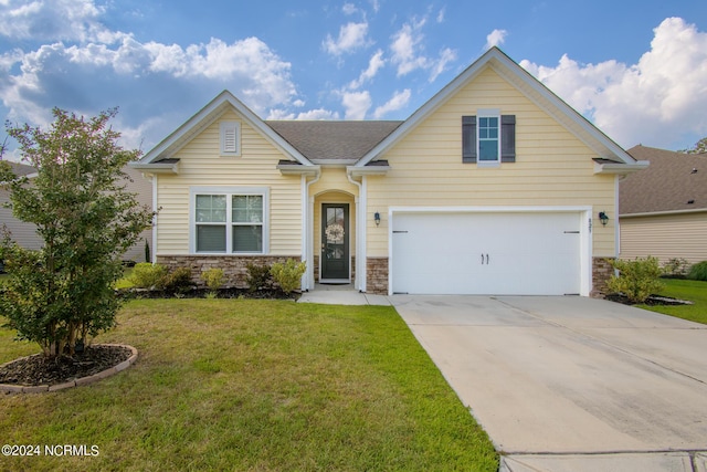 view of front of home with a garage and a front yard