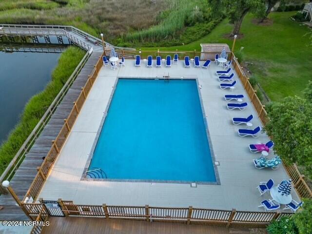 view of pool with a water view