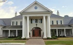 neoclassical home with a chimney