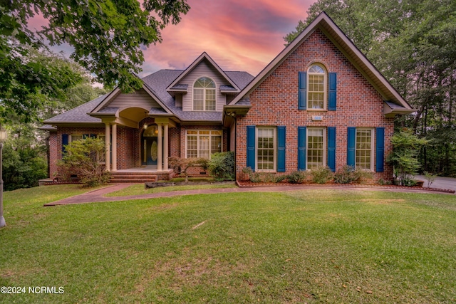 view of front of house with a lawn