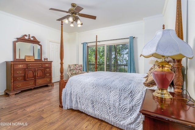 bedroom with ceiling fan, access to exterior, crown molding, and hardwood / wood-style floors