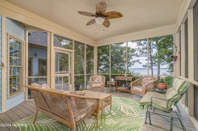 sunroom featuring ceiling fan