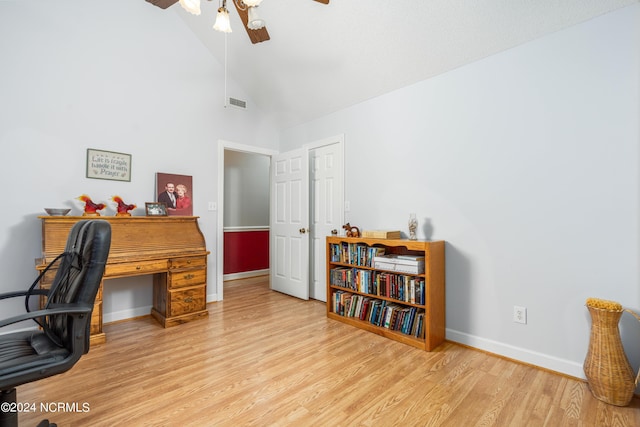 office area featuring ceiling fan, light hardwood / wood-style flooring, and high vaulted ceiling