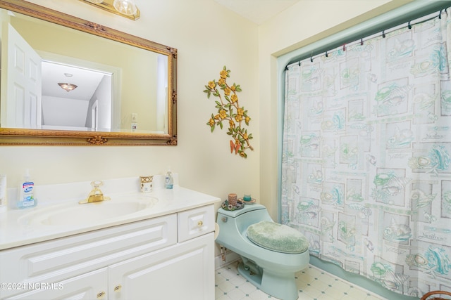 bathroom featuring toilet and vanity