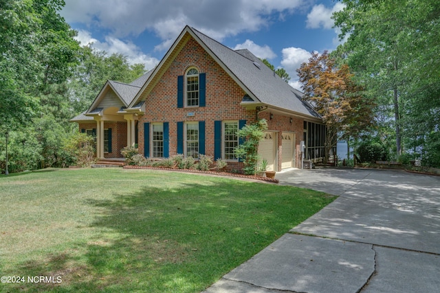 view of front facade featuring a front lawn and a garage