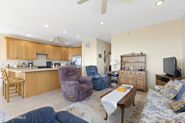 living room with ceiling fan and light tile patterned flooring