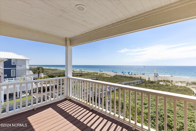 exterior space with a water view and a view of the beach