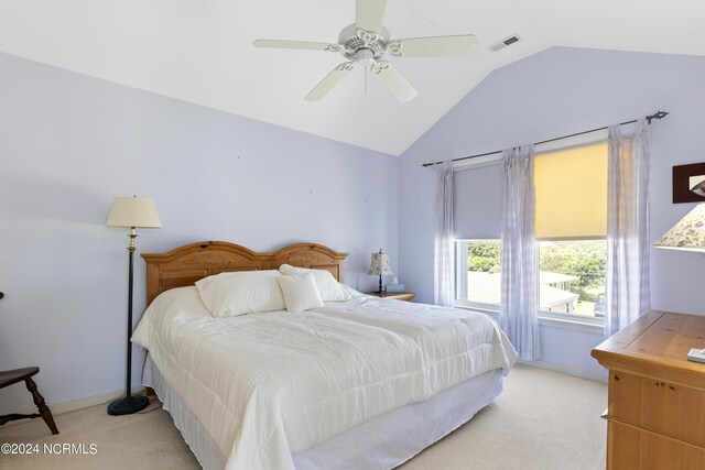 carpeted bedroom featuring ceiling fan and lofted ceiling