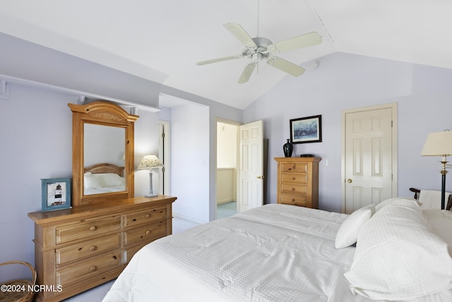 bedroom with ceiling fan, lofted ceiling, light carpet, and a closet